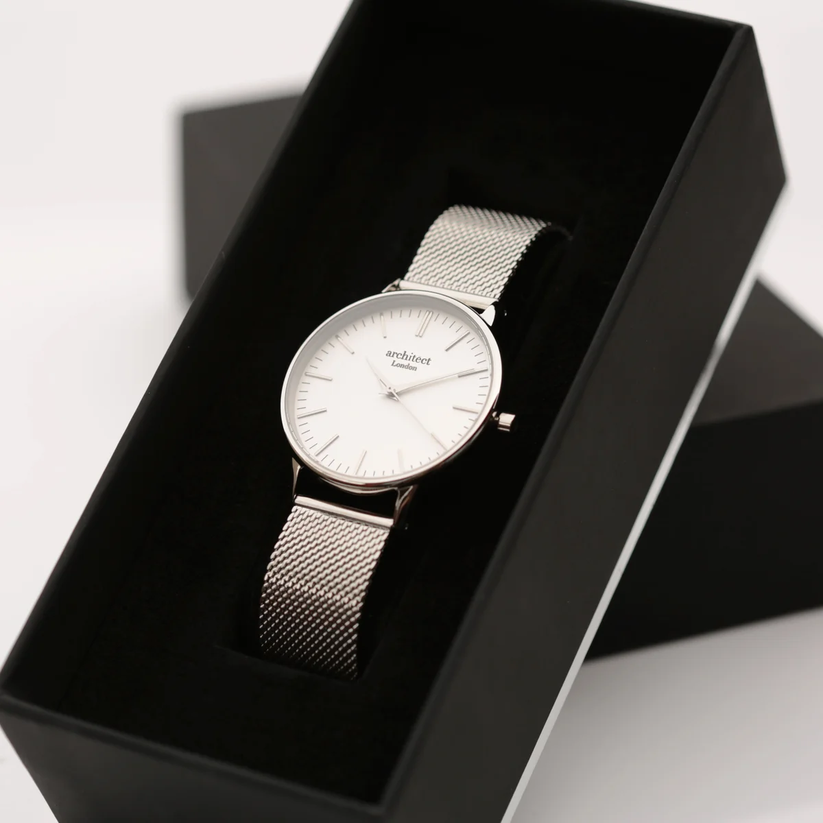 Ladies silver bezel watch with silver mesh strap and engraved watch gift message on the back, in luxury box