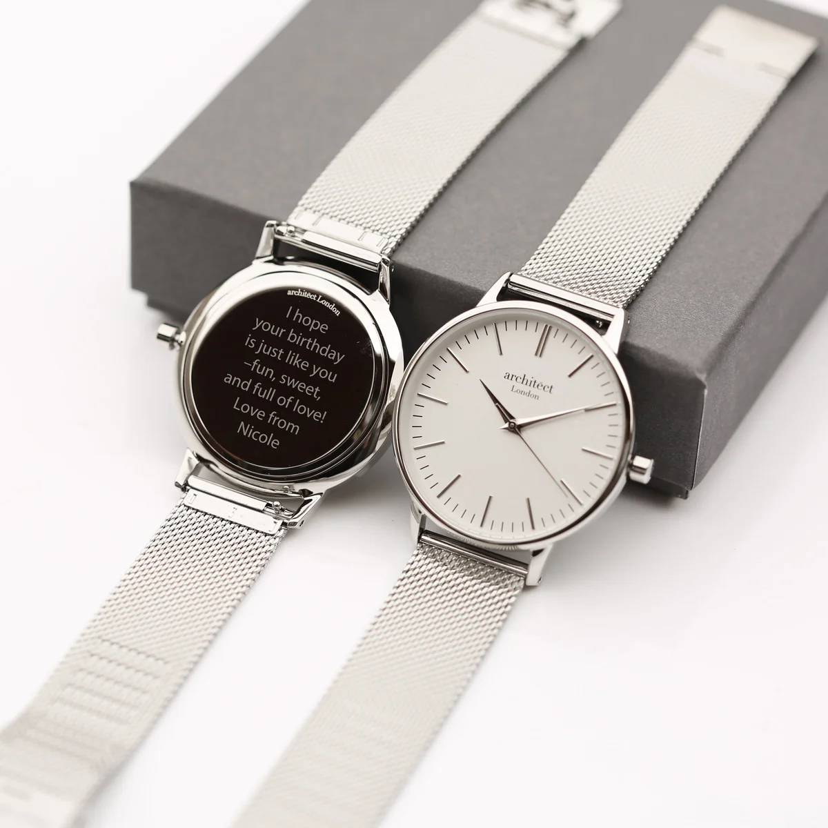 Ladies Blanc watch with silver bezel, minimalist dial, and adjustable silver mesh strap on white background