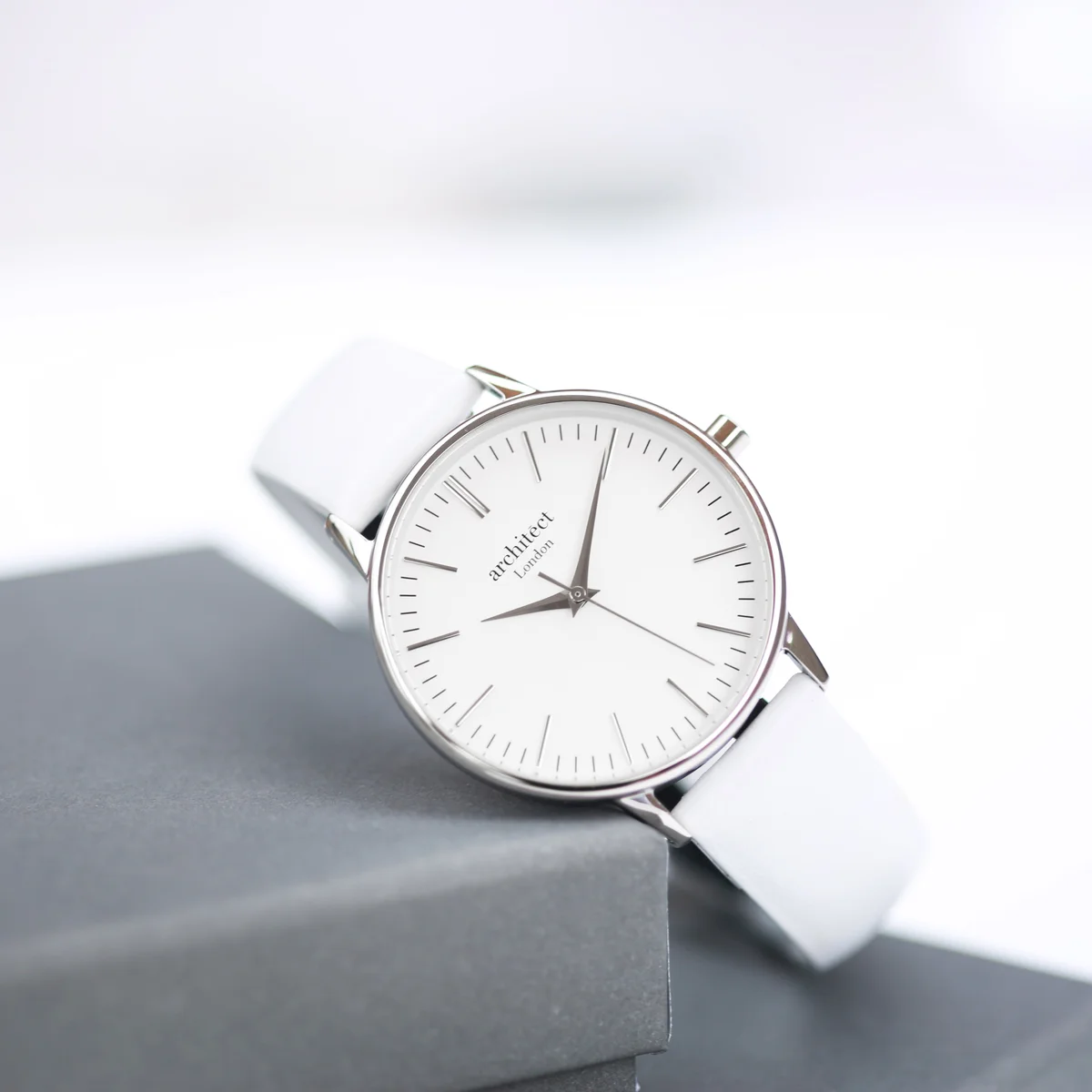 Ladies Architēct Blanc watch with silver bezel and white leather strap watch, minimalist dial, and stainless steel case