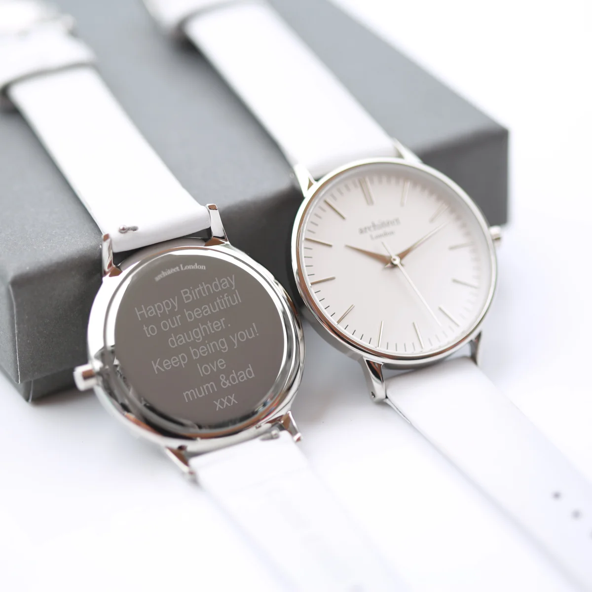 Personalised ladies watch with silver bezel, white genuine leather strap, minimalist white dial, and modern font engraving option