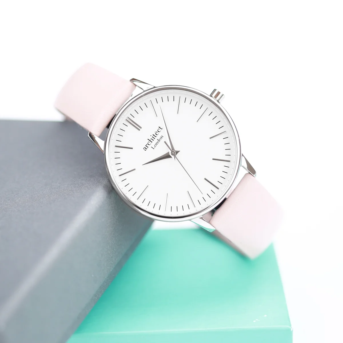 Ladies Architēct Blanc everyday elegant watch with silver bezel and light pink genuine leather strap on white background