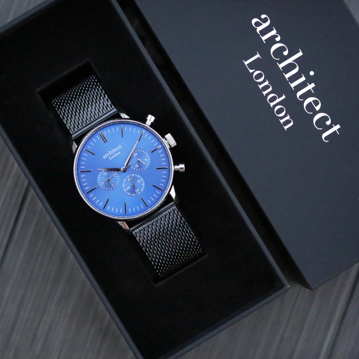 Chronograph men's watch with deep-space blue dial, black Milanese mesh strap, and three subdials on display
