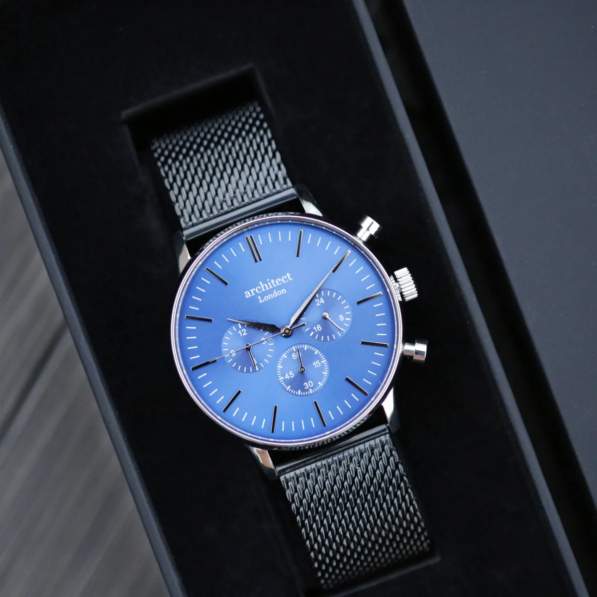 Deep-space blue chronograph watch mens with black Milanese mesh strap and three subdials on stainless steel case