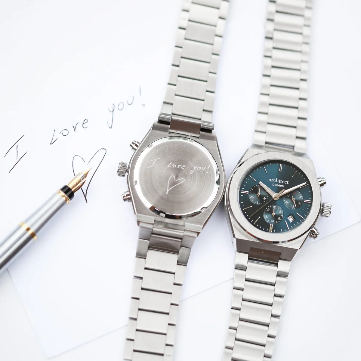 Men's engraved watch with deep blue dial, silver stainless steel band, and chronograph subdials by Architect Orbix