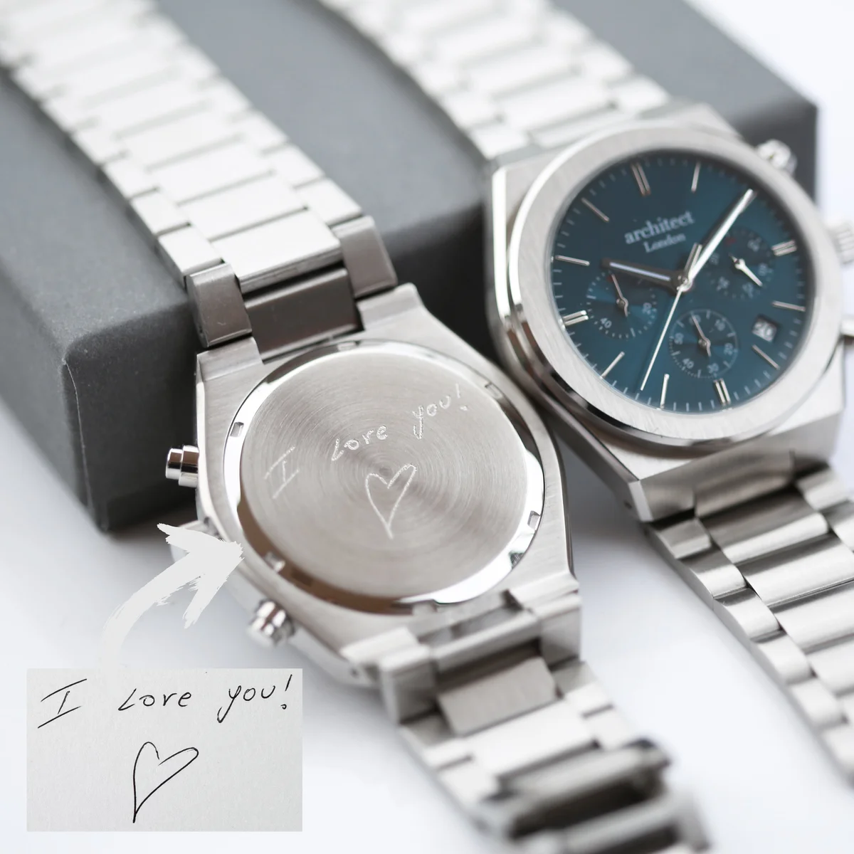 Men’s Architect Orbix blue dial watch with stainless steel bracelet and engraved back, shown in luxury watch box