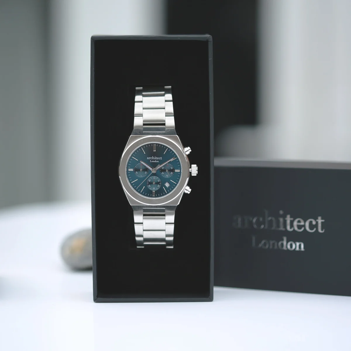 Men’s Architect Orbix blue watch showing stainless steel case and bracelet with personalized handwriting engraving on back