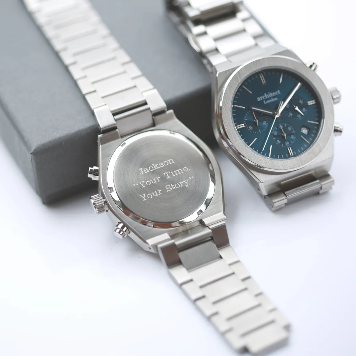 Men’s personalised watch with deep blue dial, silver stainless steel band, chronograph subdials, and modern font engraving area