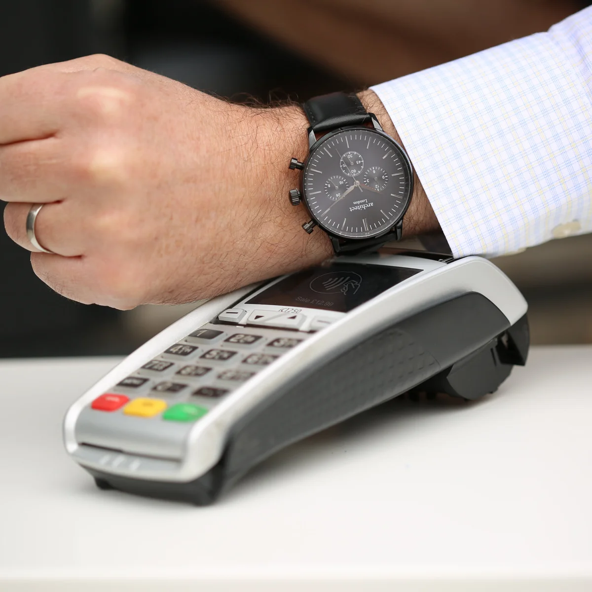 Men's contactless payment watch with jet black strap and modern font engraving on the face