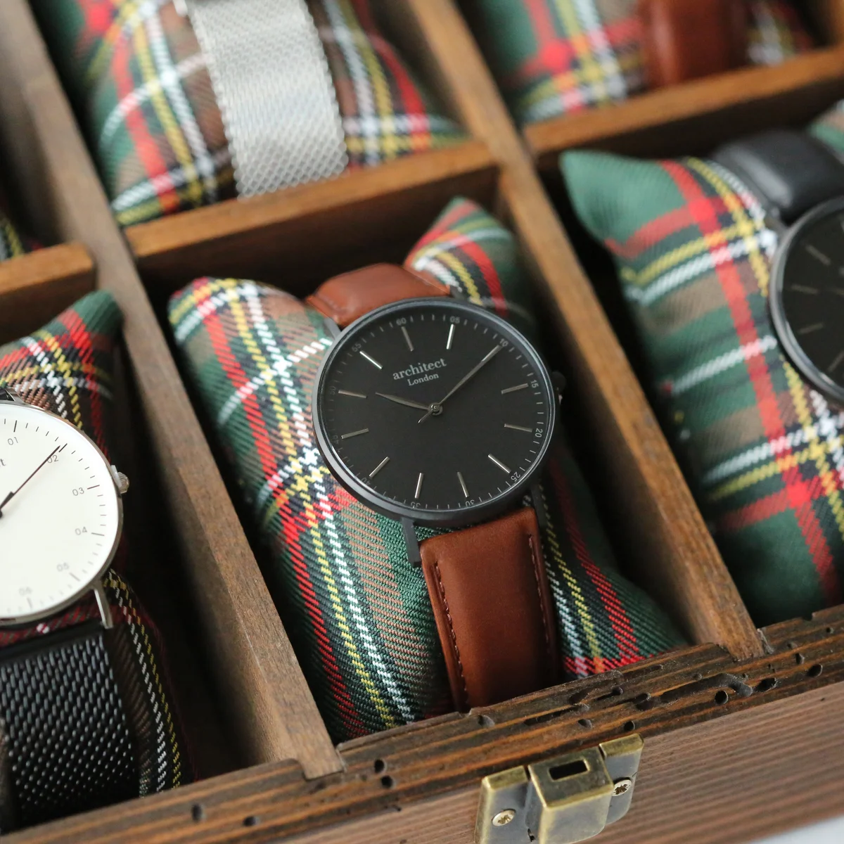 Men's contactless payment watch with minimalist design and brown walnut strap showing modern font engraving on face