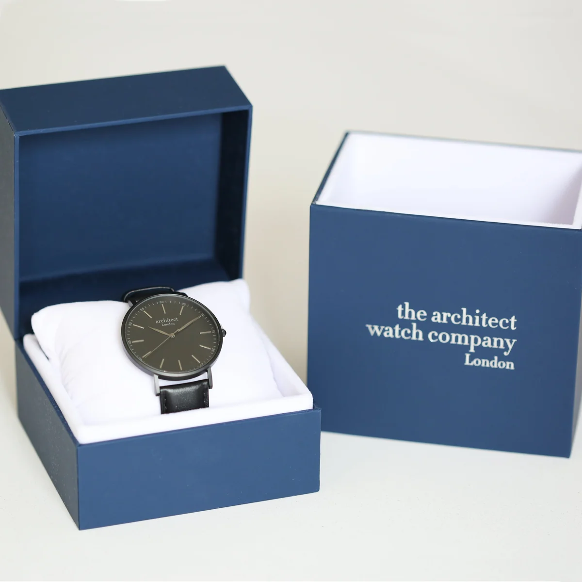 Men’s contactless payment watch with minimalist black strap and modern font engraving on the face