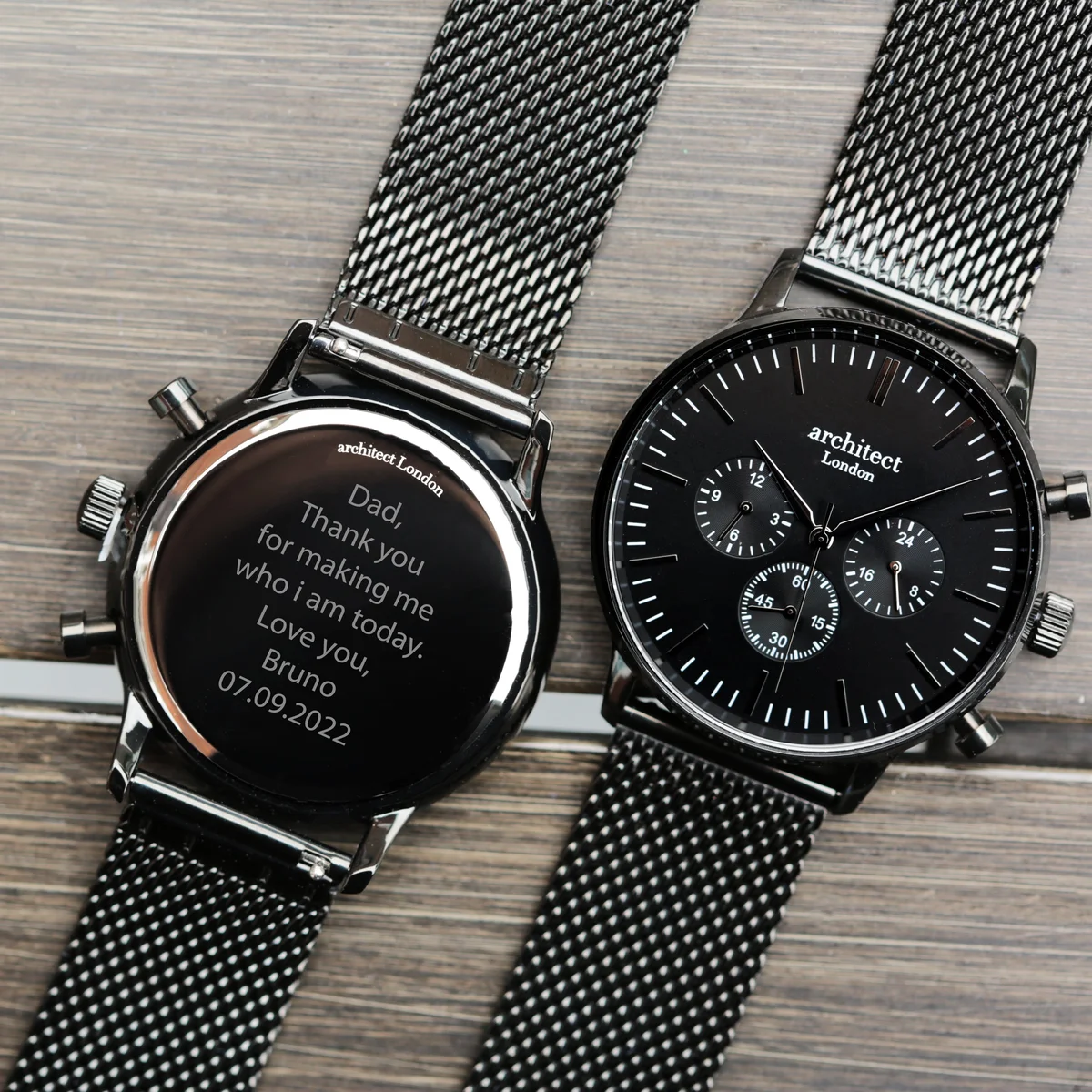 Men’s black mesh strap watch with black dial, three chronograph subdials, and polished stainless steel case