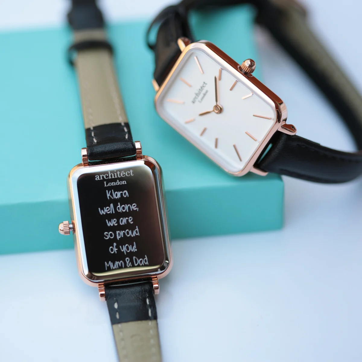 Brilliant white women's leather strap watch with stainless steel case and minimalist dial on black leather band