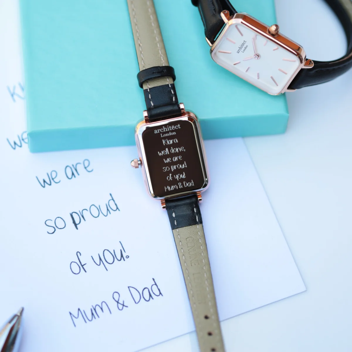 Brilliant white ladies Japanese quartz watch with black leather strap and polished stainless steel case on white background
