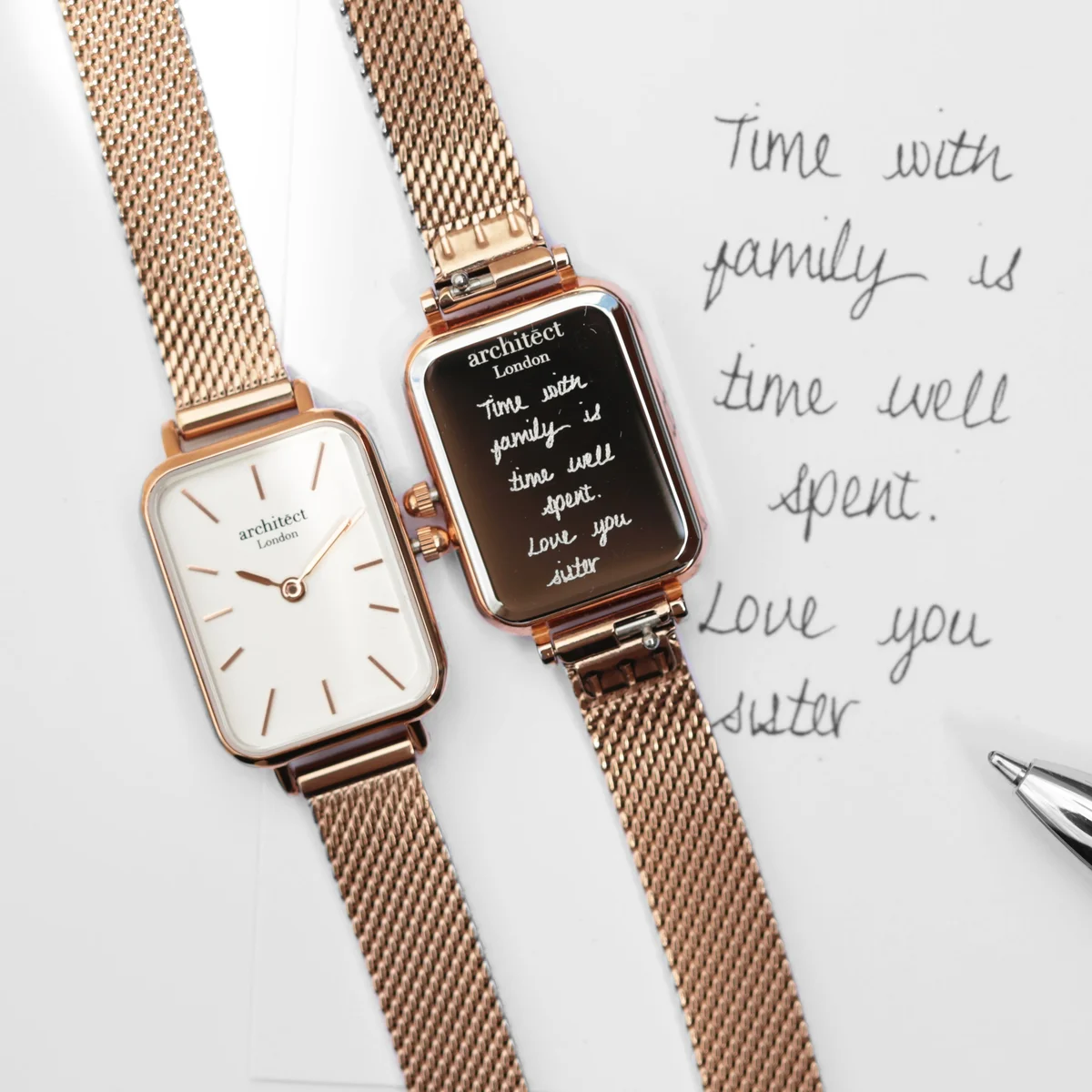 Rose gold ladies personalised watch with mesh strap and minimalist dial, shown on white background with luxury box