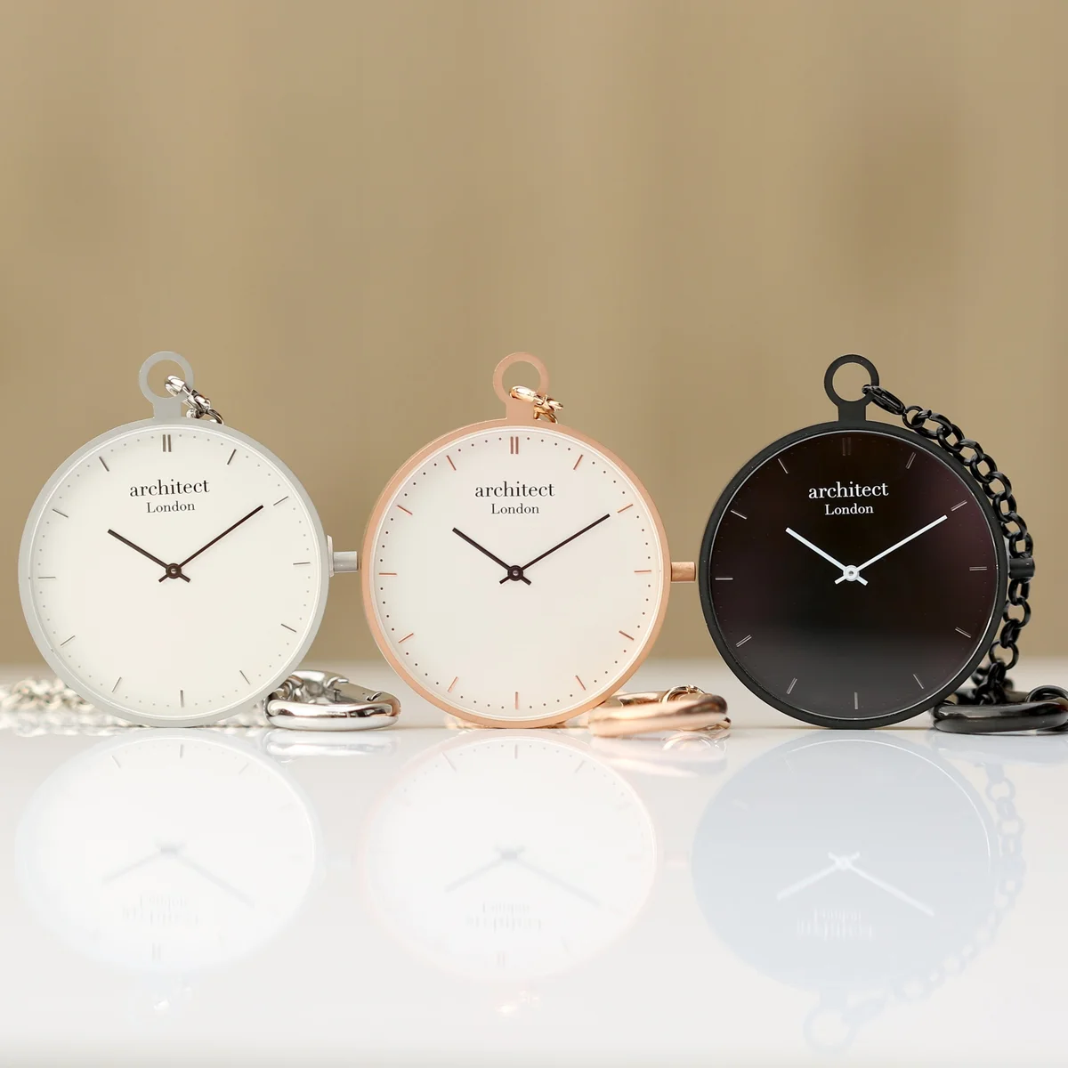 Brushed rose gold modern pocket watch with sapphire glass, showing engraved gift watch space on the back panel