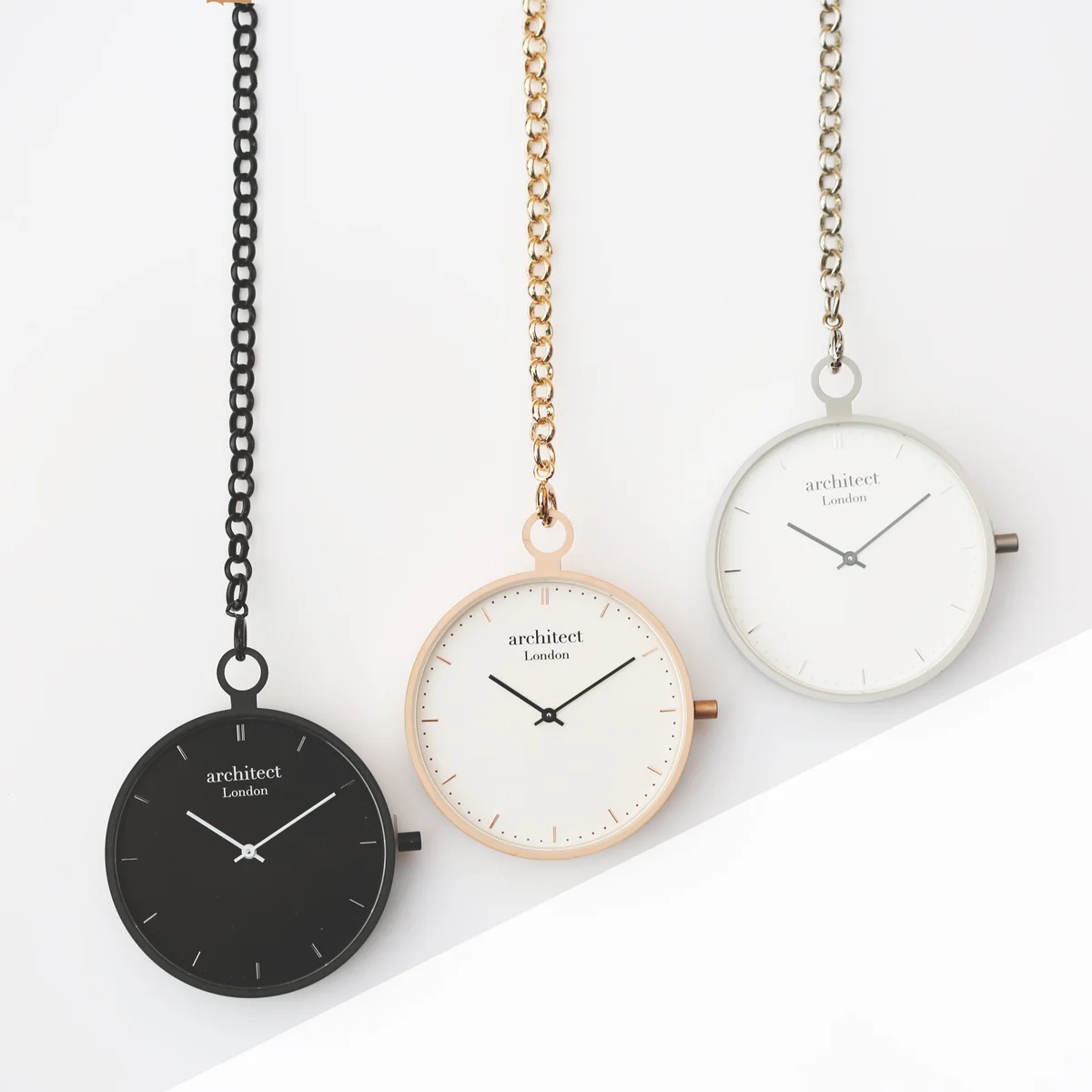 Modern silver engraved pocket watch with brushed stainless steel case and visible Swiss movement mechanism inside