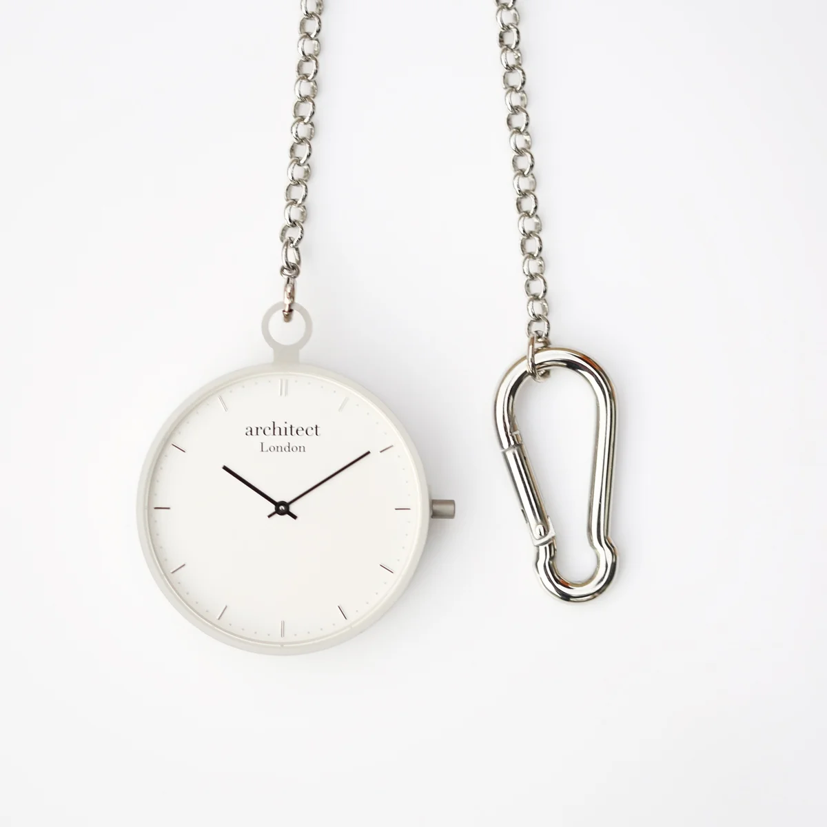 Modern pocket watch with brushed silver case and clear sapphire glass, showcasing Swiss movement watch mechanism inside