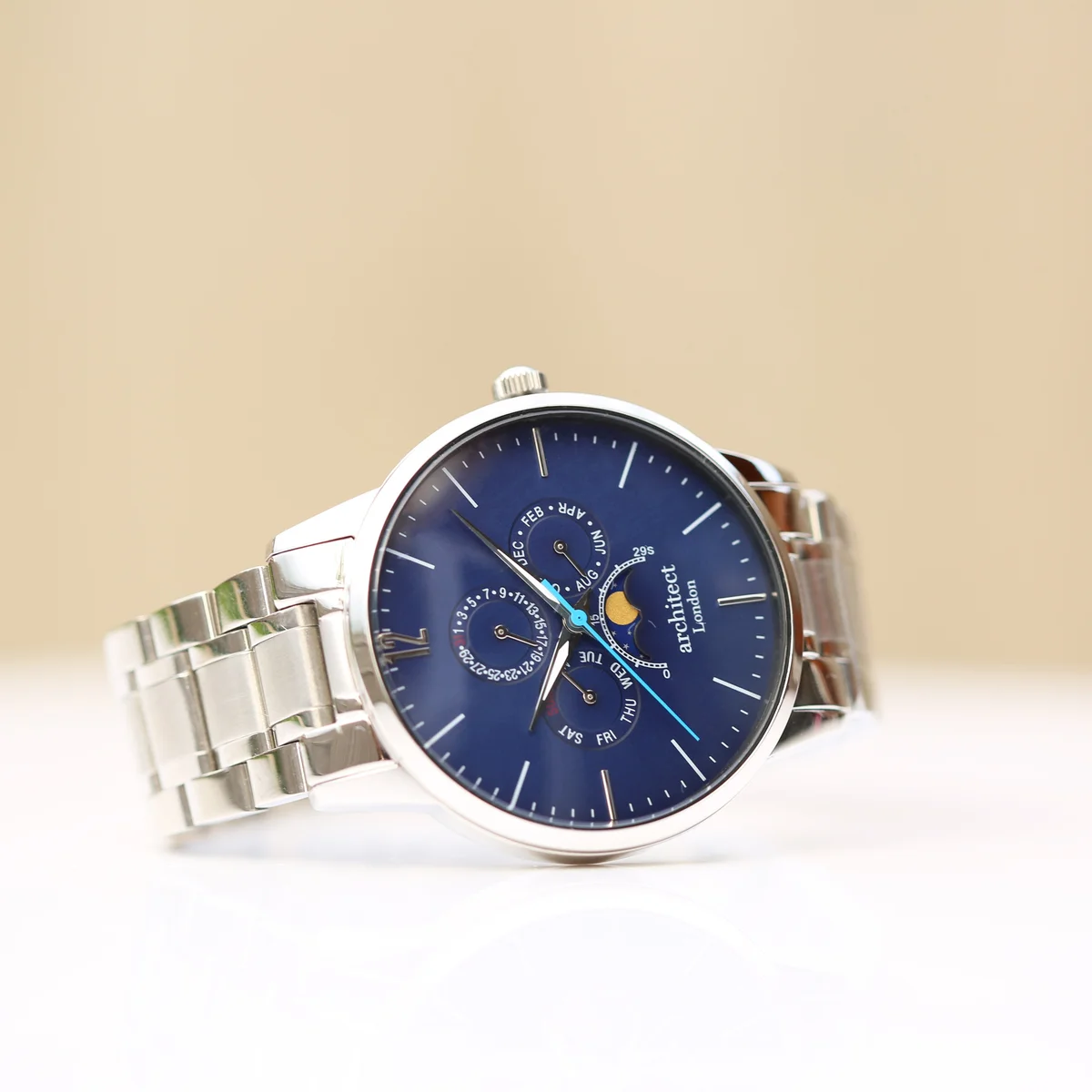 Blue dial stainless steel watch with moonphase and chronograph subdials, polished silver strap, 43mm case diameter