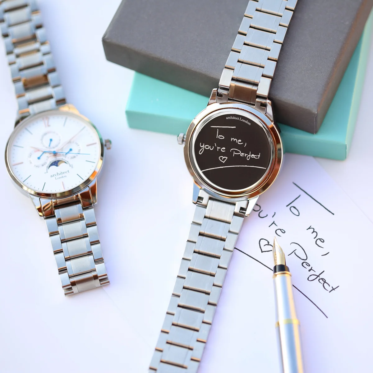 White Architect Apollo moonphase watch with silver strap, chronograph dials, and Japanese movement watch mechanism visible