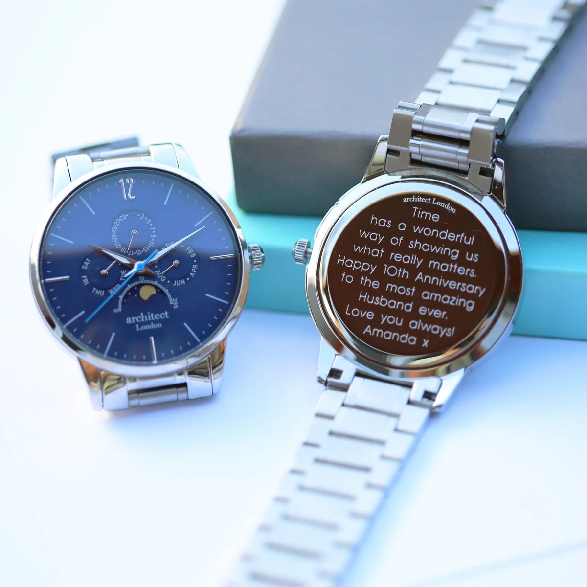 Blue dial Japanese movement watch with moonphase and chronograph subdials, silver stainless steel strap, luxury watch box included