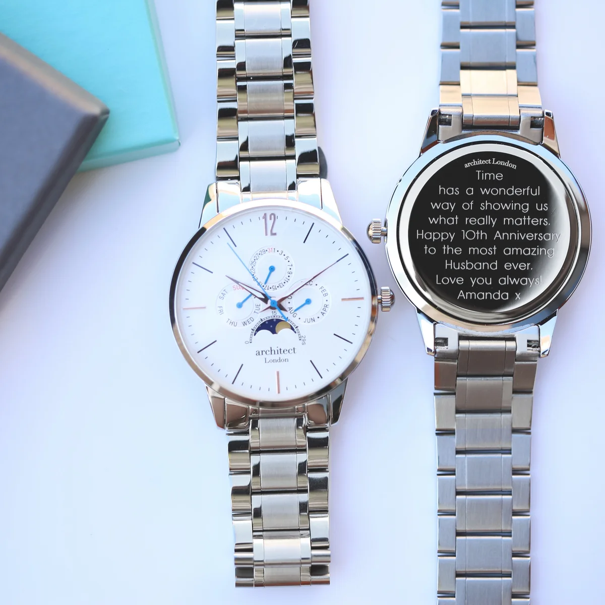 Men's moonphase watch with white dial, silver stainless steel strap, three chronograph subdials, and moonphase display
