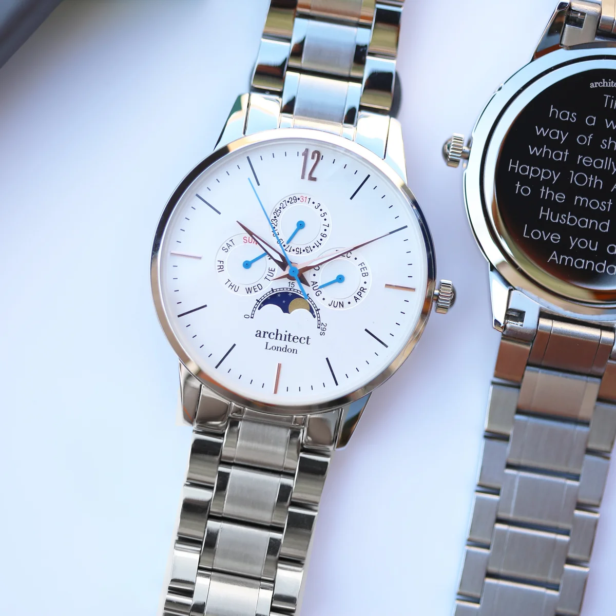 White Architect Apollo Japanese movement watch with silver stainless steel strap and moonphase dial on white background