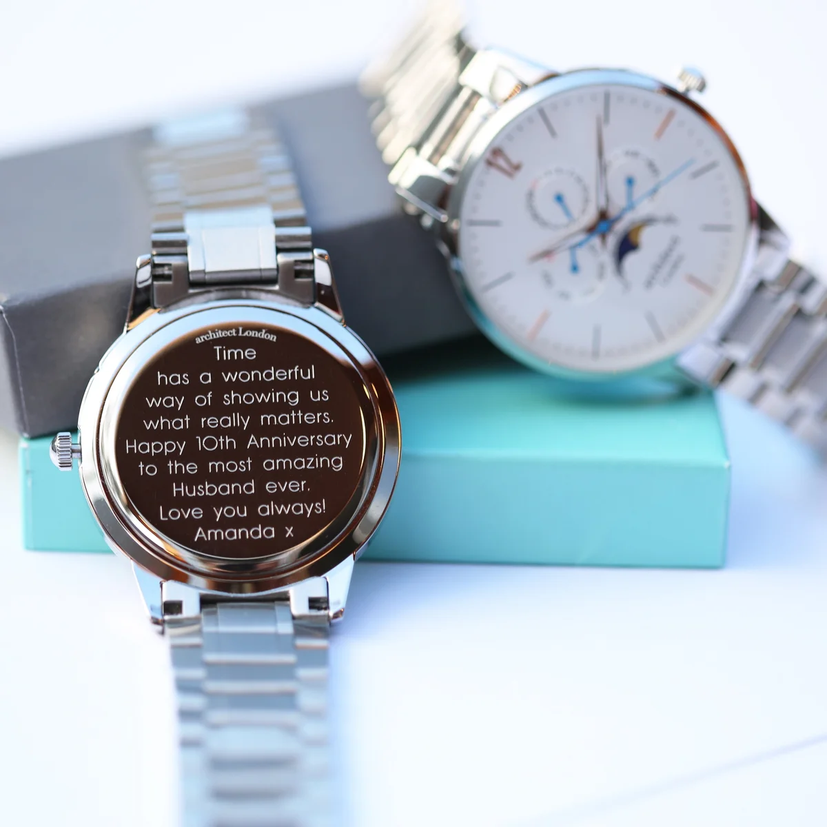 Men’s moonphase watch with white dial, silver stainless steel strap, three chronograph subdials, and moonphase display