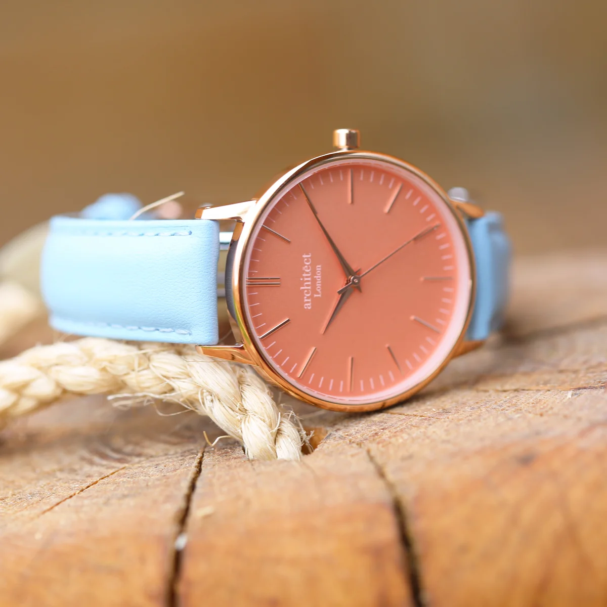 Ladies Architēct Coral quartz movement watch with apricot coral dial and light blue genuine leather strap on white background