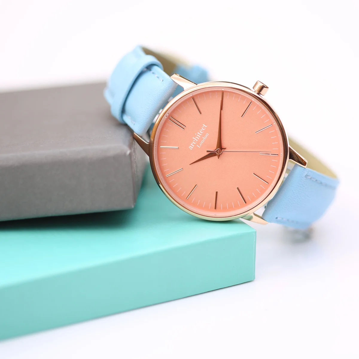 Ladies Architēct Coral watch with apricot coral dial and light blue genuine leather strap watch on white background