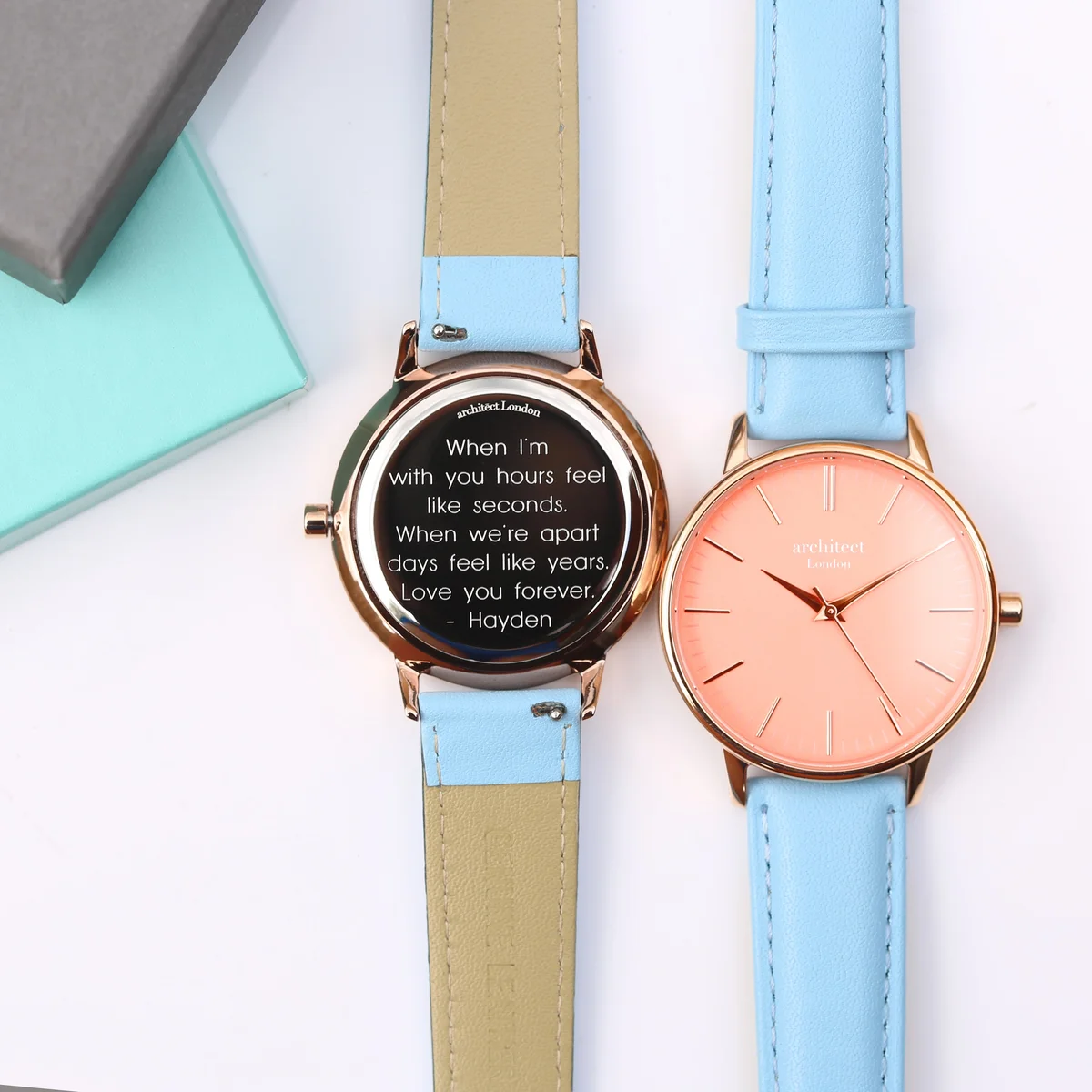 Ladies Architēct Coral stainless steel case watch with apricot dial and light blue genuine leather strap on white background