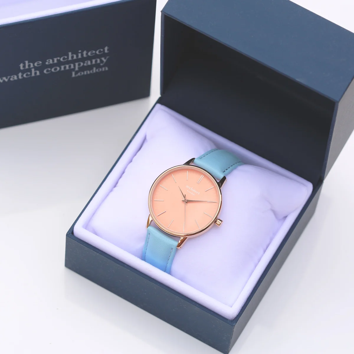 Ladies coral watch with apricot dial, light blue genuine leather strap, stainless steel case, and modern font engraving option