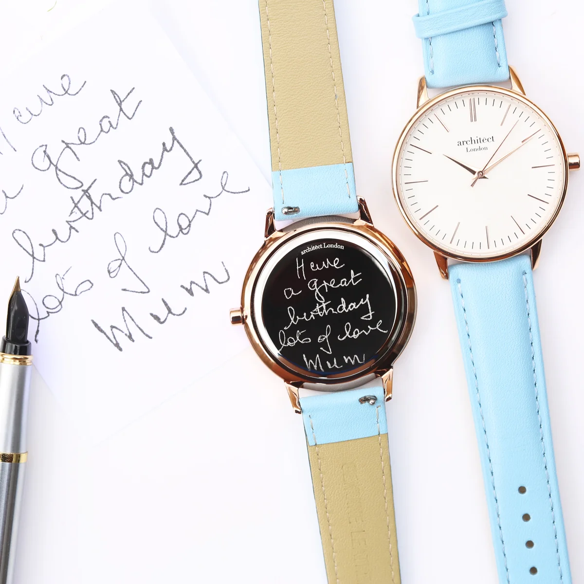 Ladies personalised watch with light blue genuine leather strap and stainless steel case, featuring handwriting engraving on back