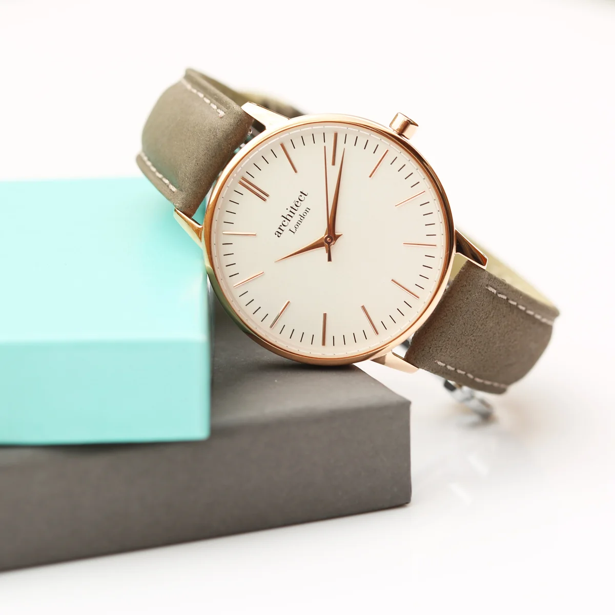 Personalised ladies watch with light grey leather strap, stainless steel case, and minimalist white dial with engraving option