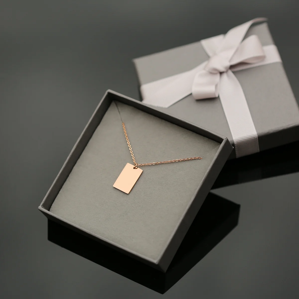 Dazzle personalised handwriting necklace in rose gold with engraved message on rectangular pendant and 48cm chain in gift box