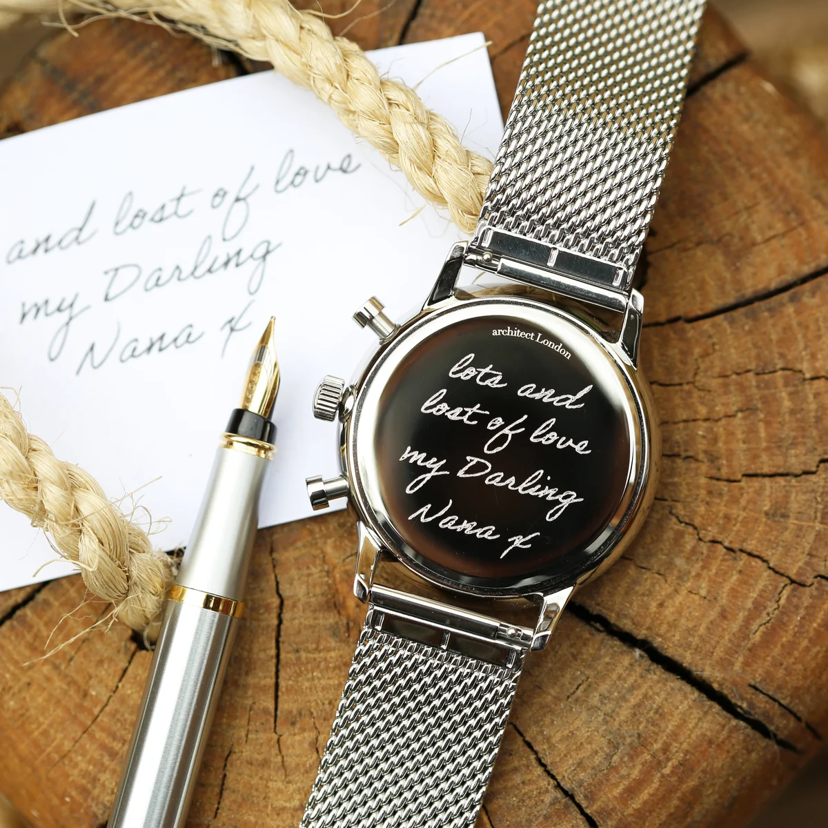 Luxury men's watch gift with green dial, silver Milanese mesh strap, and customizable handwriting engraving on back