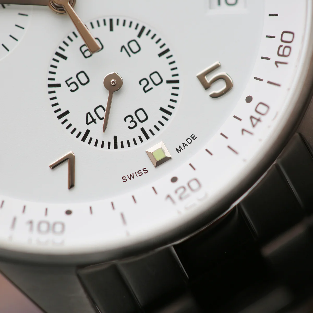 Swiss Made engraved chronograph watch with stainless steel case, sapphire glass, and modern font engraving on back