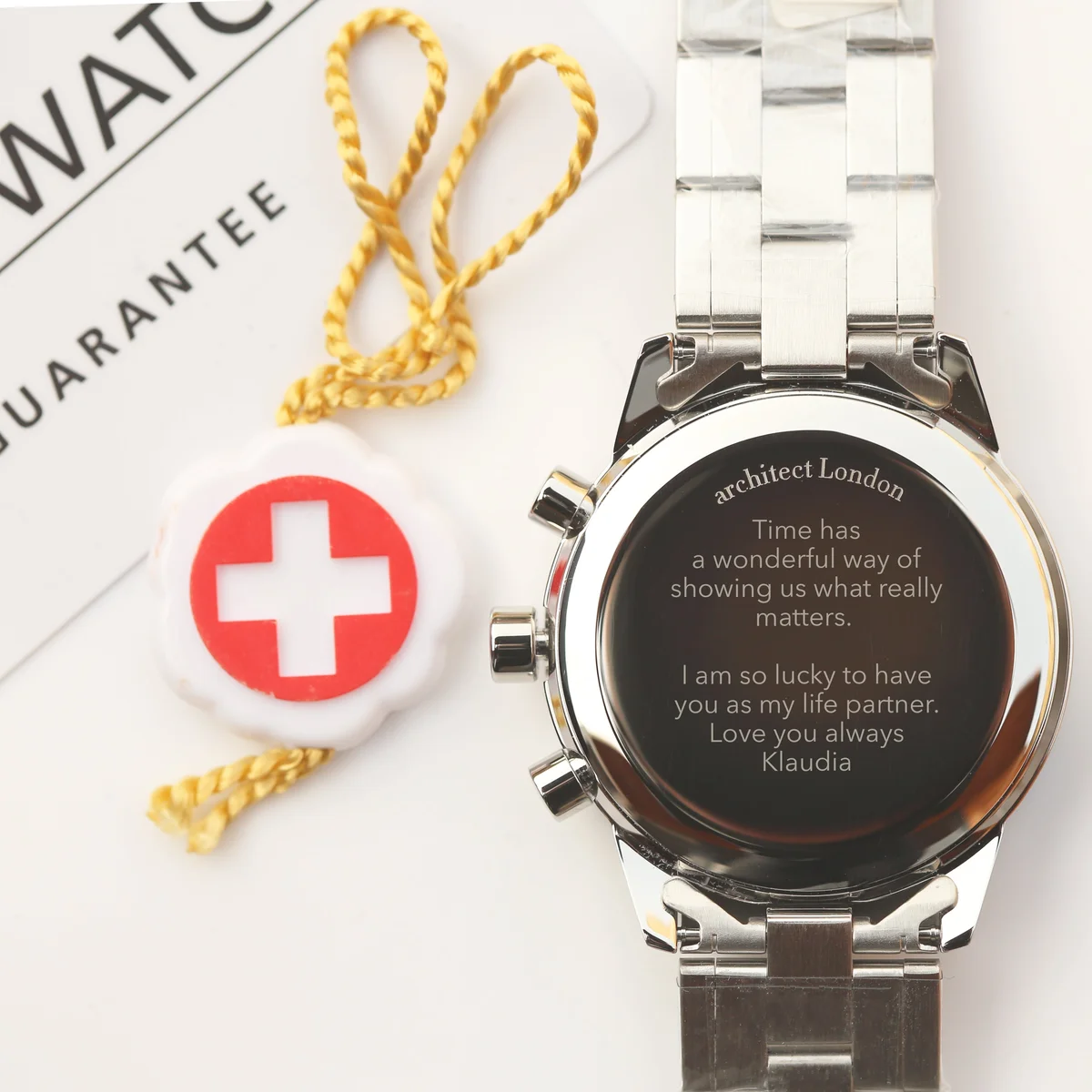 Swiss Made Architect Endeavour water resistant watch with stainless steel band and glow in the dark chronograph dials on white background
