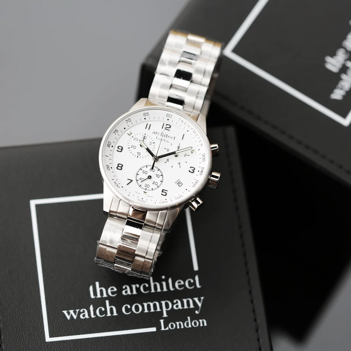 Swiss made men's watch Architect Endeavour with stainless steel case, chronograph dials, and modern font engraving area on back