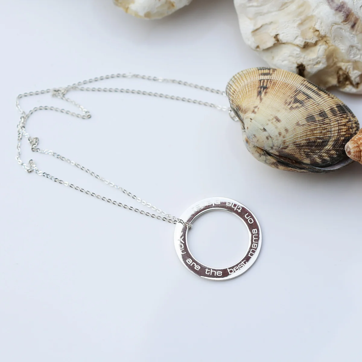 Sterling silver circle halo necklace with fine Italian chain and engraved modern font message on pendant