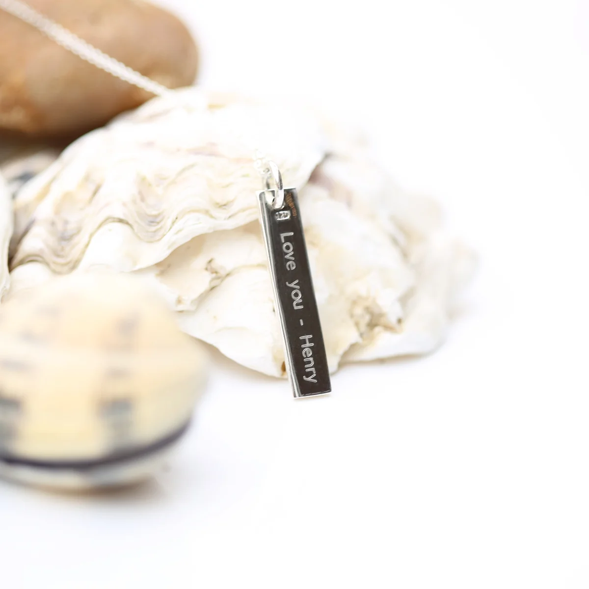 Sterling silver necklace with engraved rectangular bar pendant on a fine Italian-made chain against white background