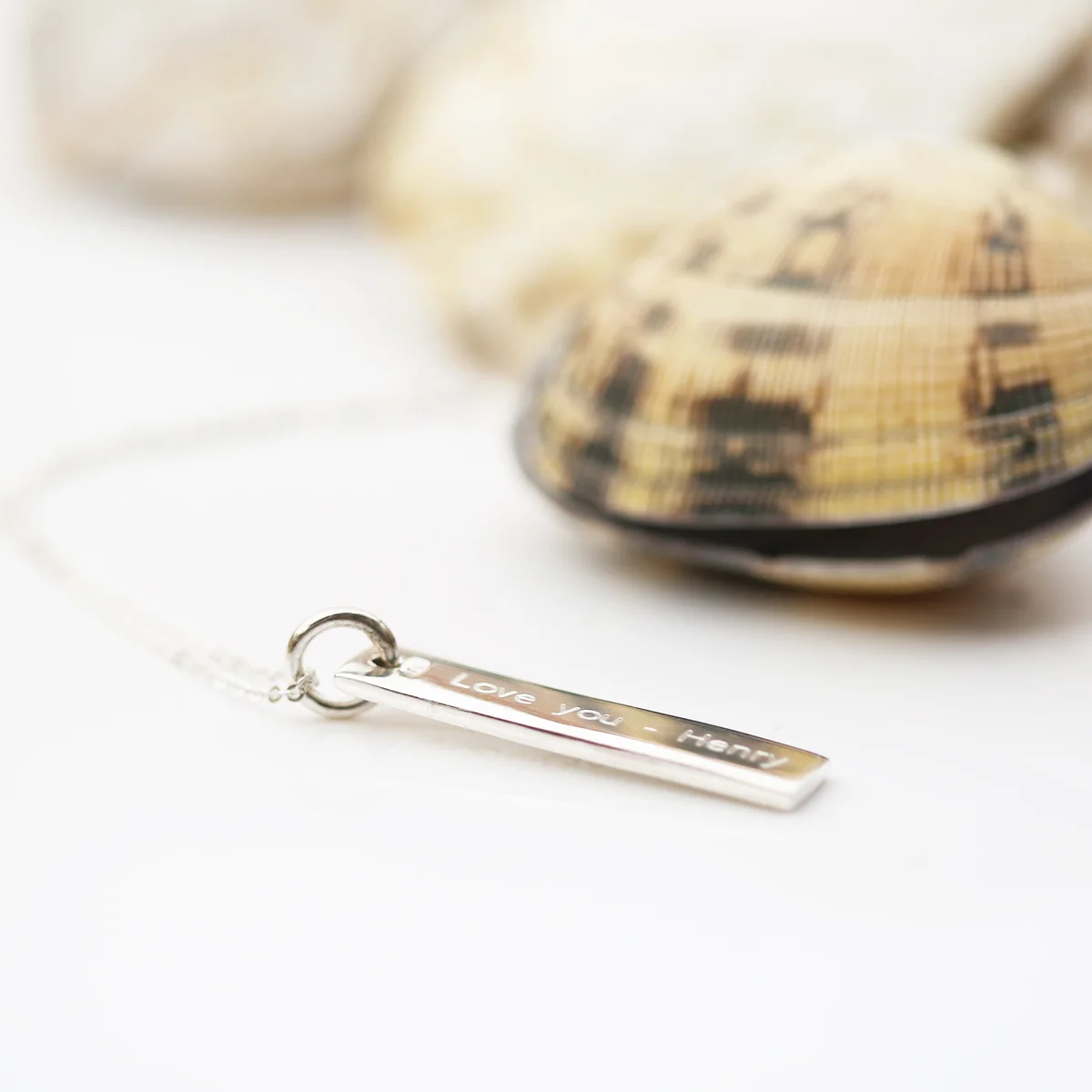 Sterling silver engraved silver necklace with a rectangular bar pendant on a fine Italian-made chain displayed on white background