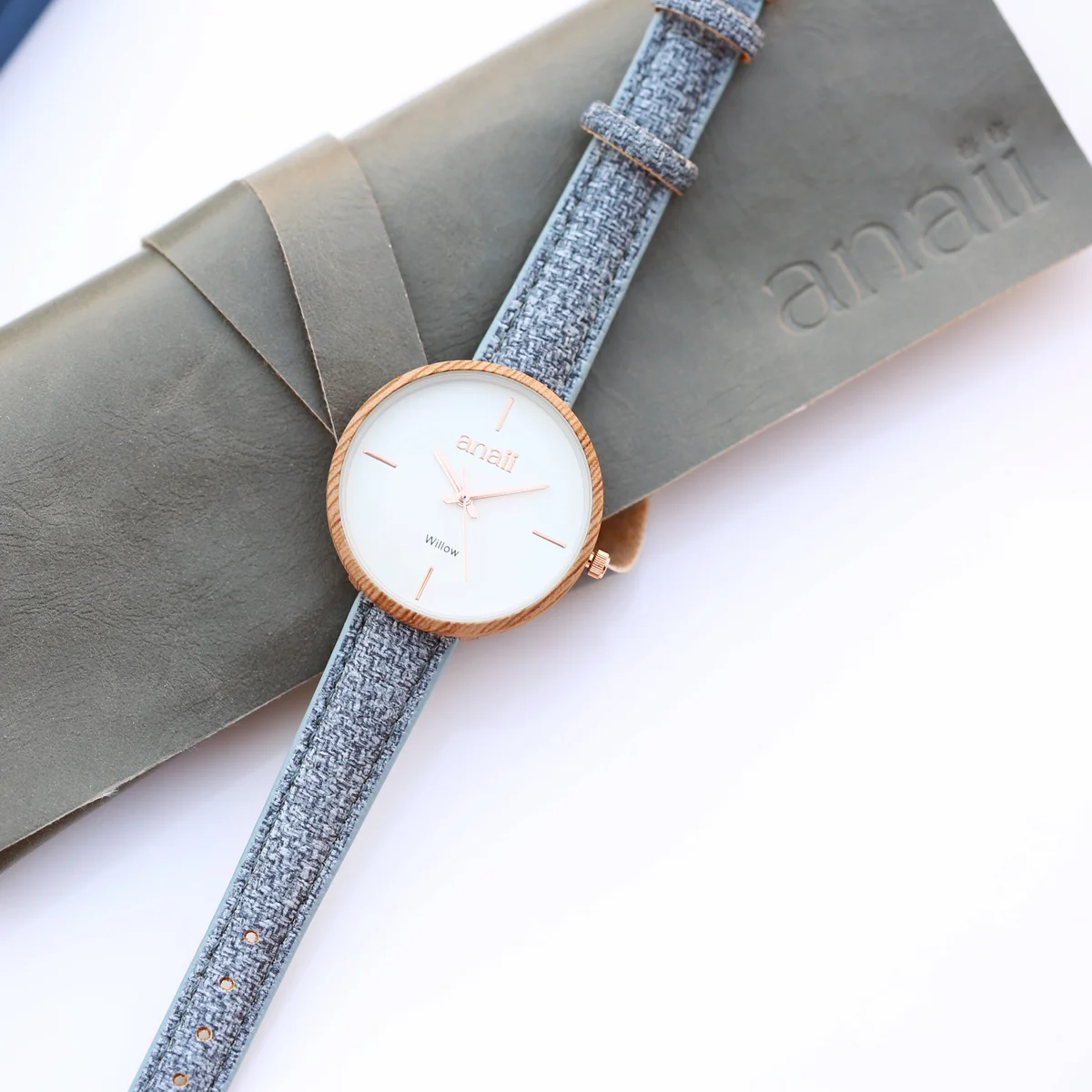 Lake blue Anaii watch with stainless steel case and adjustable strap watch displayed on white background