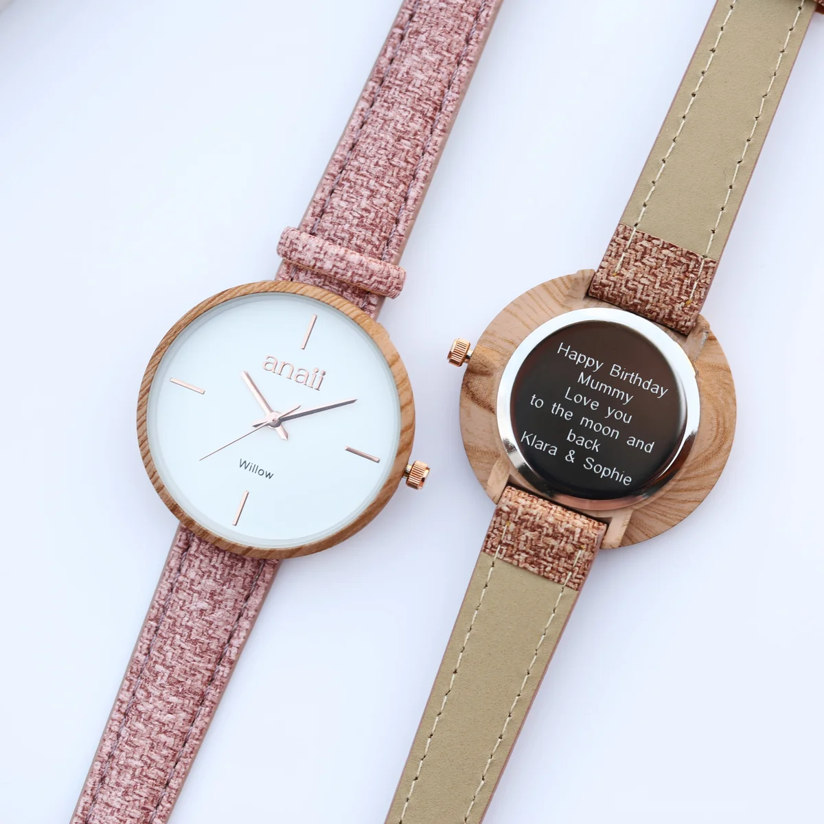 Personalised ladies watch in sweet pink with stainless steel case and adjustable strap displayed with gift box and pouch