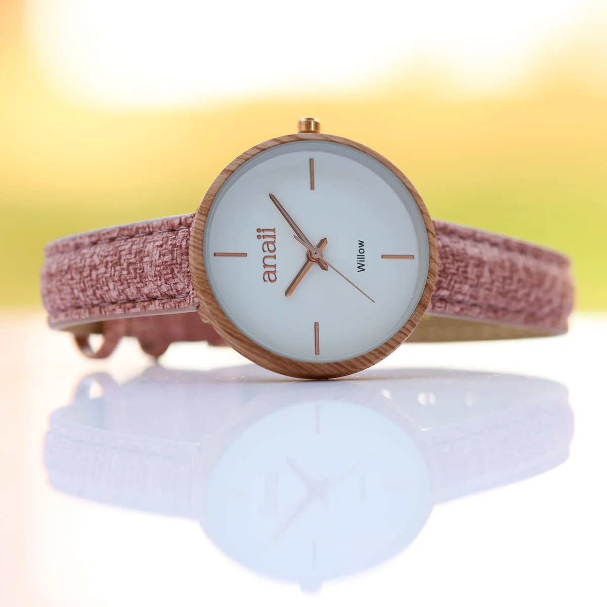 Pink ladies watch with minimalist design, stainless steel case, adjustable strap, displayed with gift box and pouch