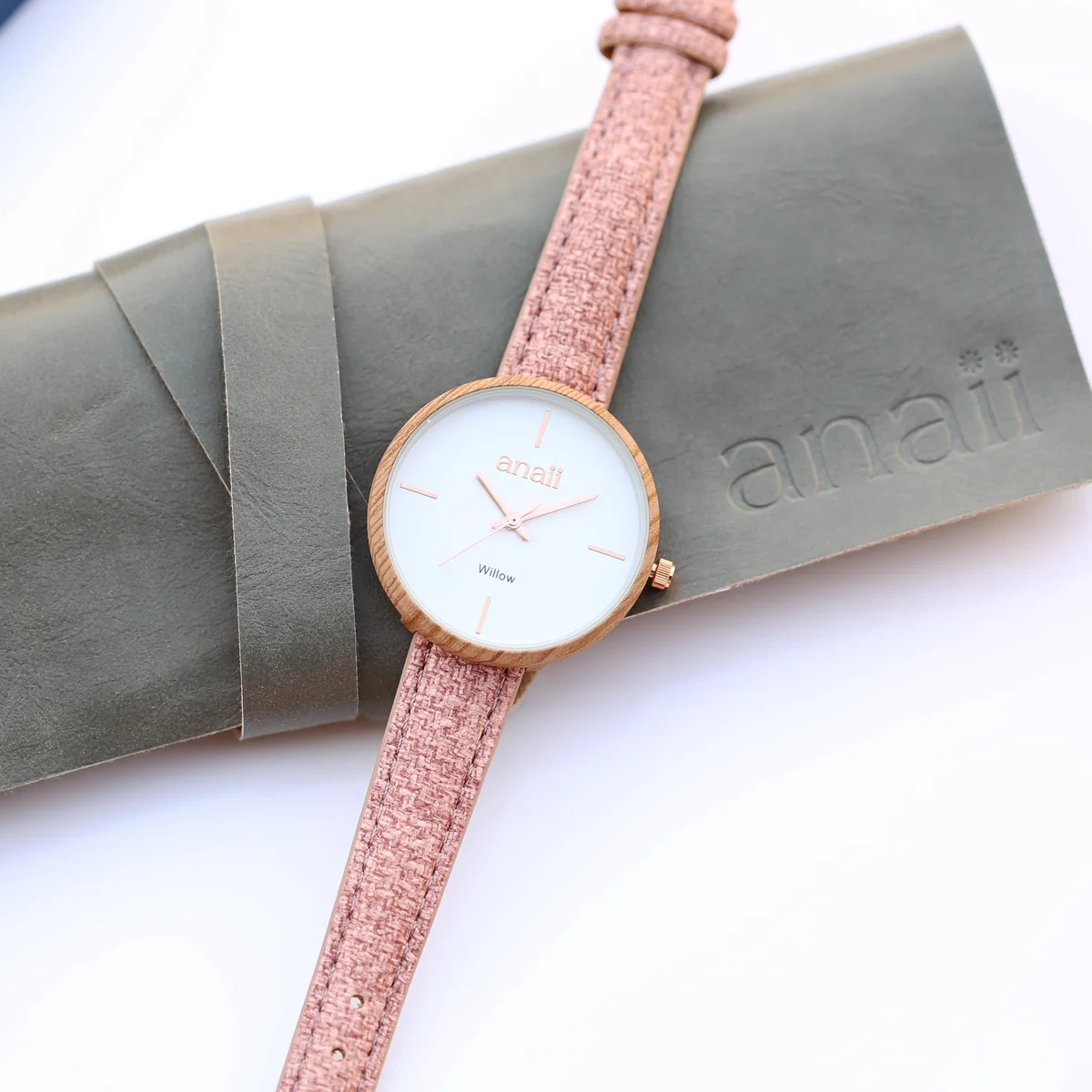 Sweet Pink Anaii engraved watch for her with stainless steel case and adjustable strap displayed on white background