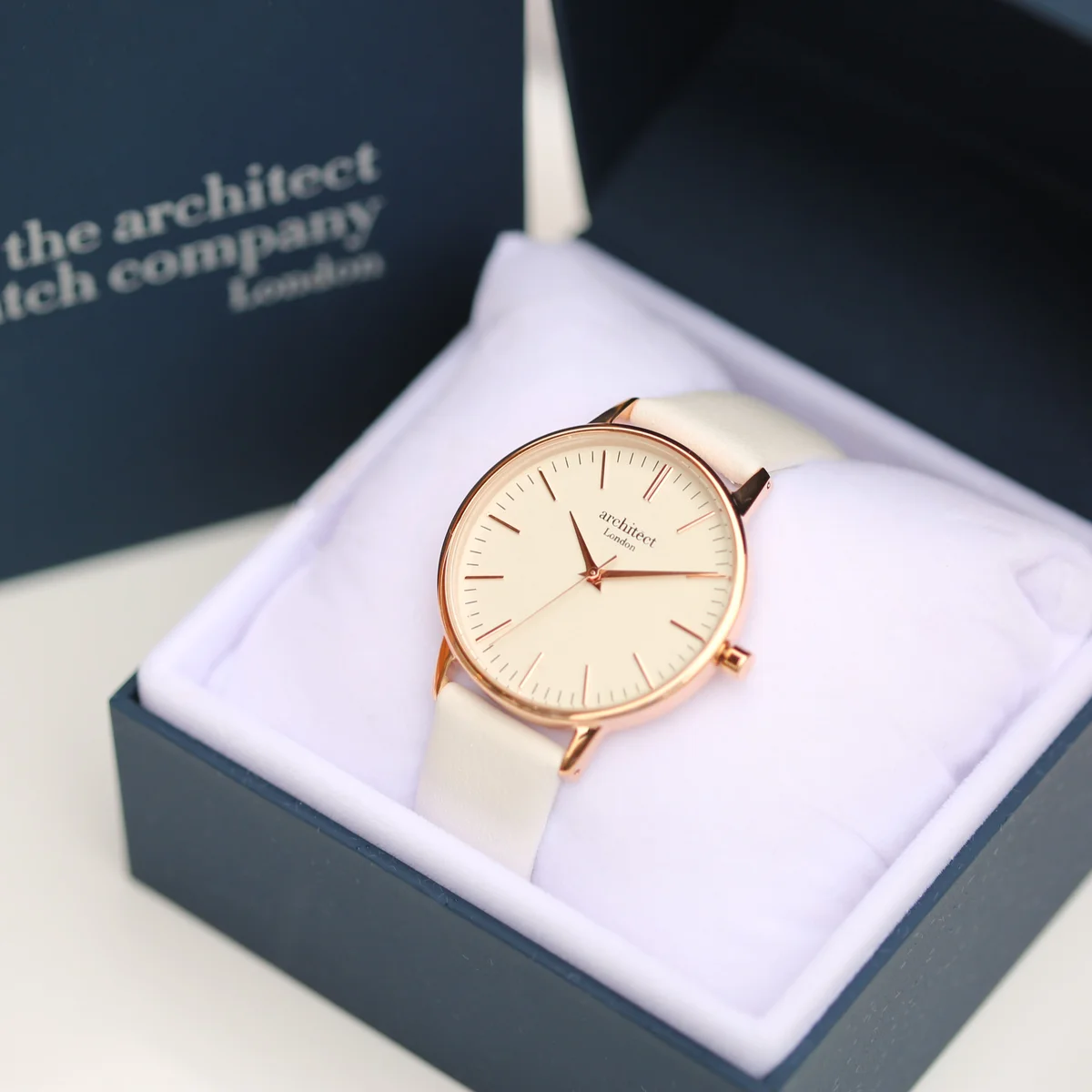 Ladies Architēct Blanc stainless steel case watch with white genuine leather strap and engraved handwriting on the back