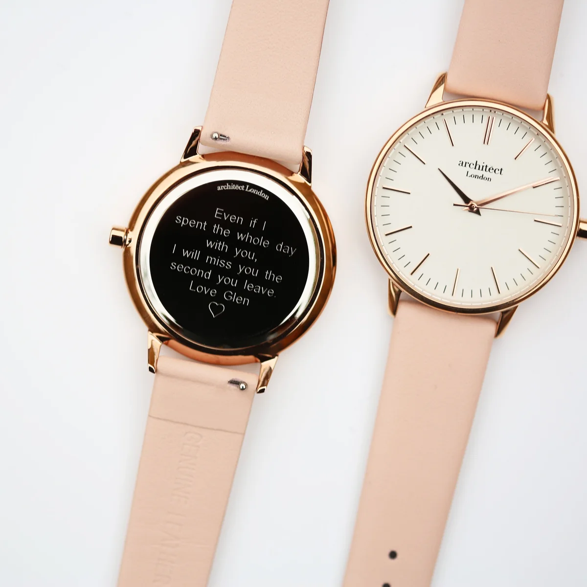 Ladies personalised watch with modern font engraving, stainless steel case, and light pink genuine leather strap on white background