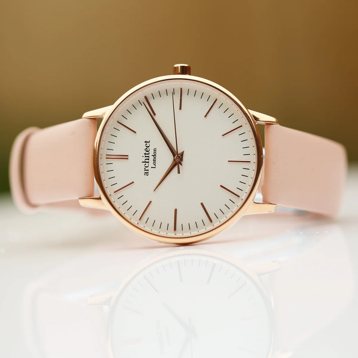 Ladies Blanc watch with light pink leather strap and modern font engraving on polished stainless steel case back
