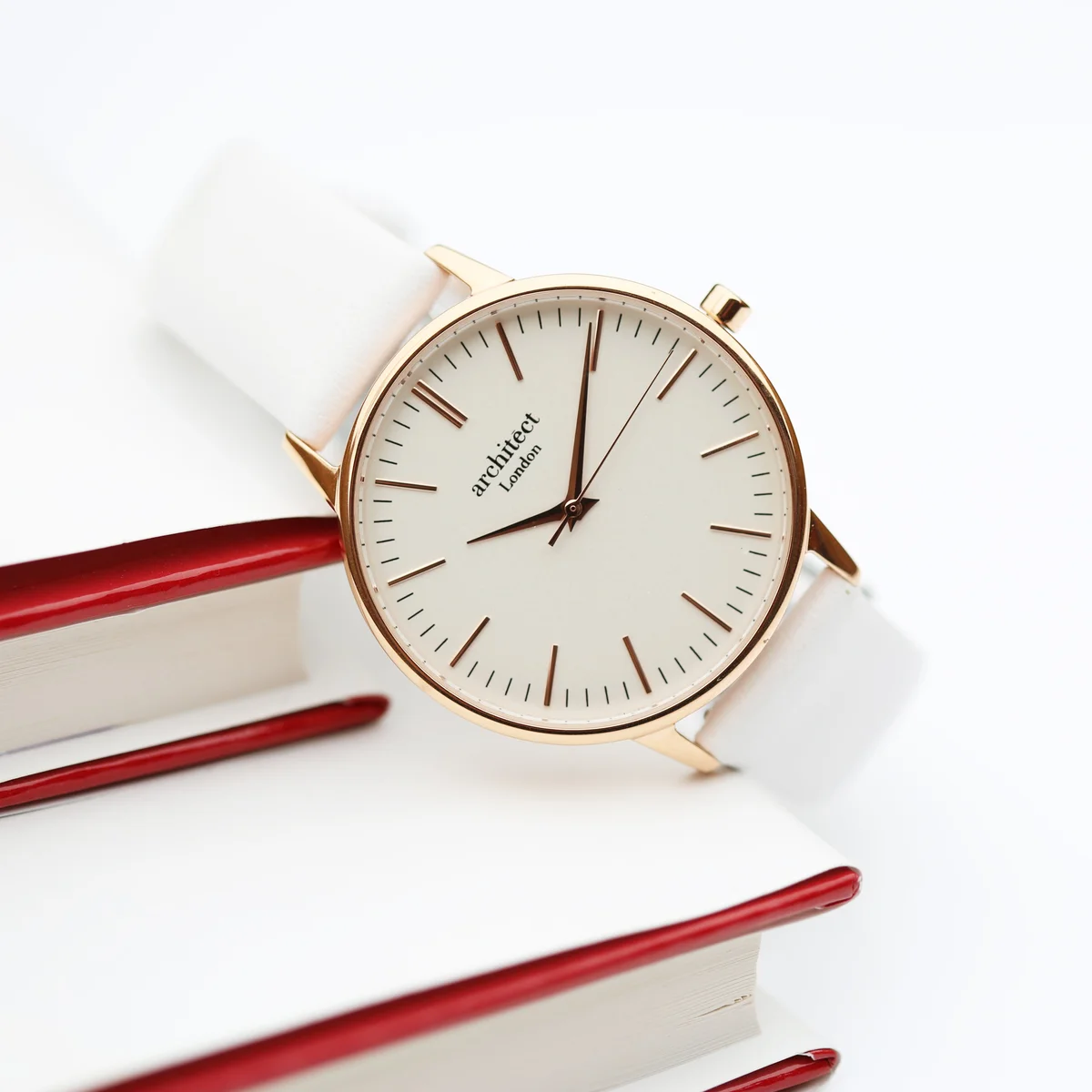 Ladies Architēct Blanc stainless steel case watch with white genuine leather strap and minimalist white dial on wrist