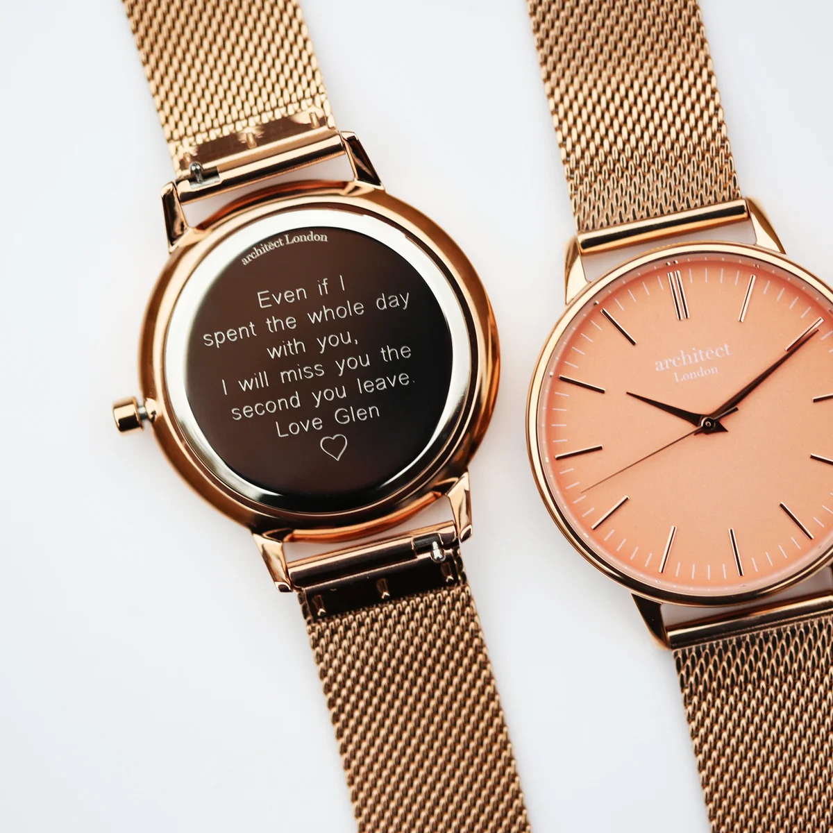 Personalised ladies watch with apricot coral dial, rose gold mesh strap, and modern font engraving on stainless steel case back